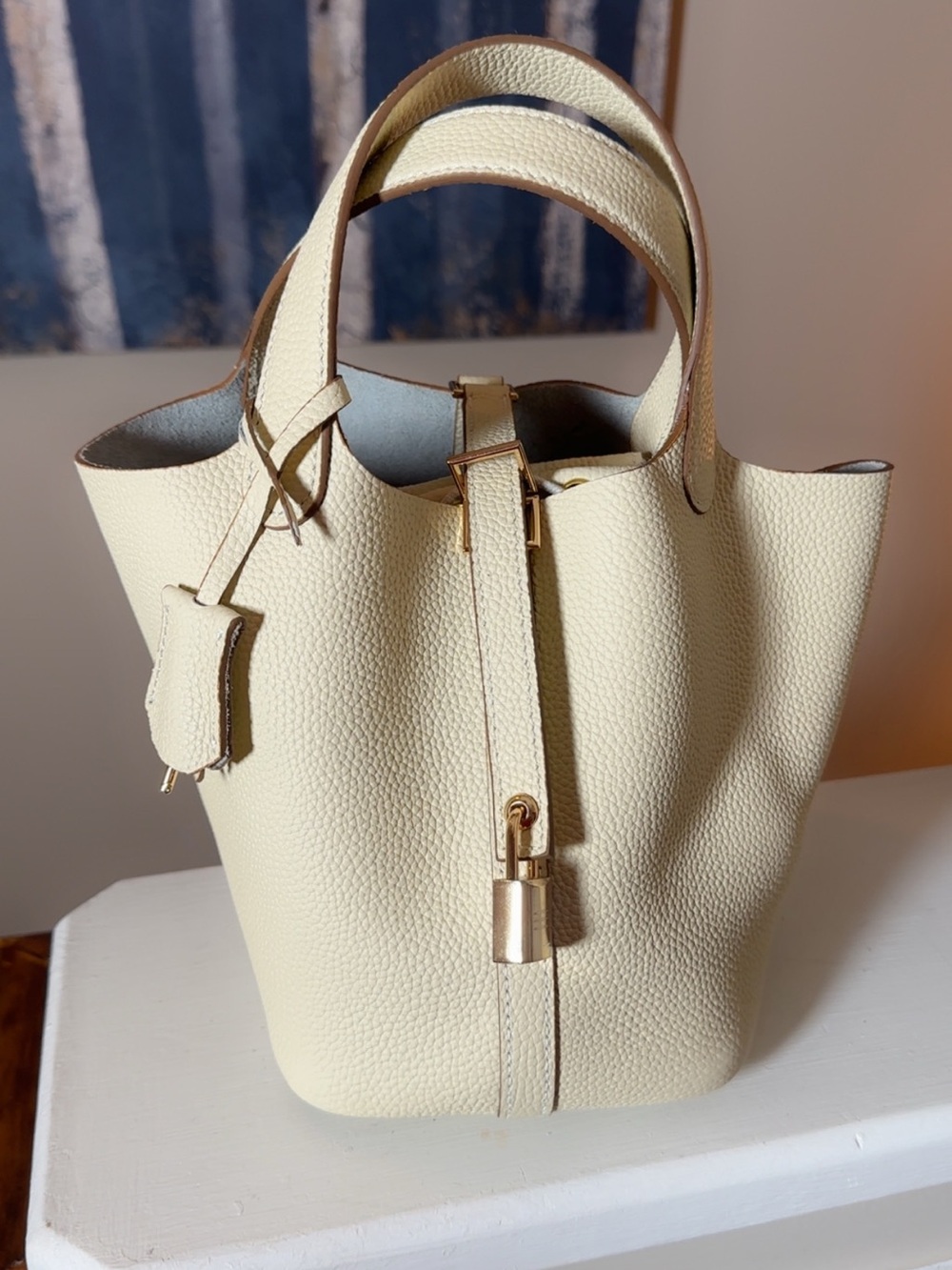Amazon Cream Pebbled Leather Bucket Tote with Gold Accent